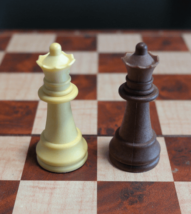 Queen Chess Pieces on a Chess Board